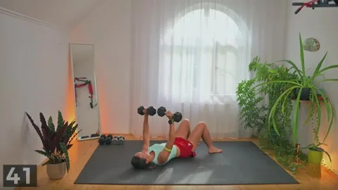 Chest press demonstration with two dumbbells