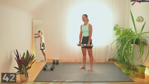 Upright row demonstration with two dumbbells