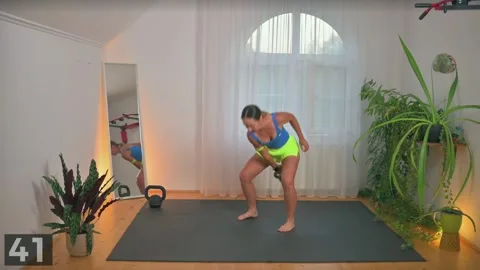 Alternating single-arm swing demonstration with one kettlebell