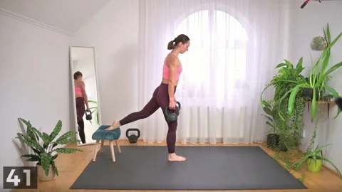 Bulgarian split squat demonstration with two kettlebells