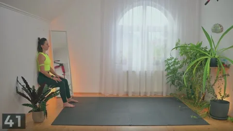 Wall sit demonstration with bodyweight